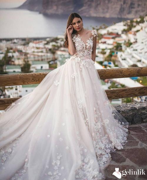 Çiçek Desenli Transparan Omuzlu Salaş Model Gelinlik